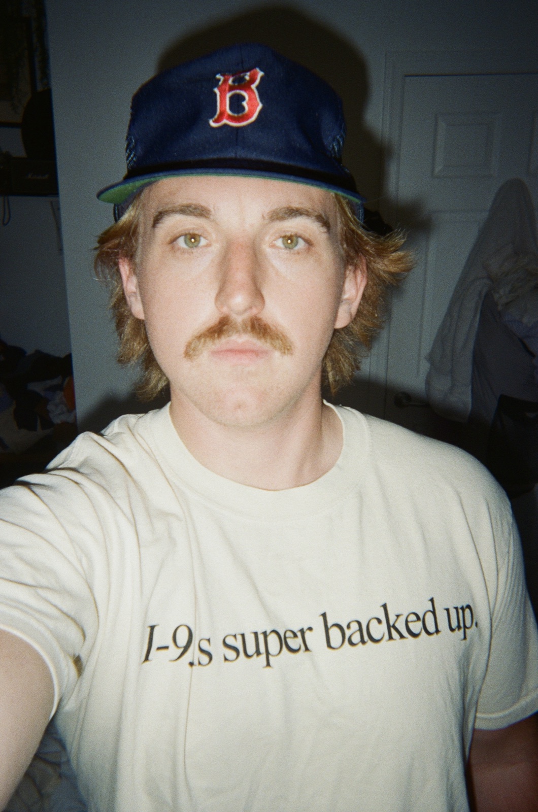 Cole wearing the i-95 is super backed up tee